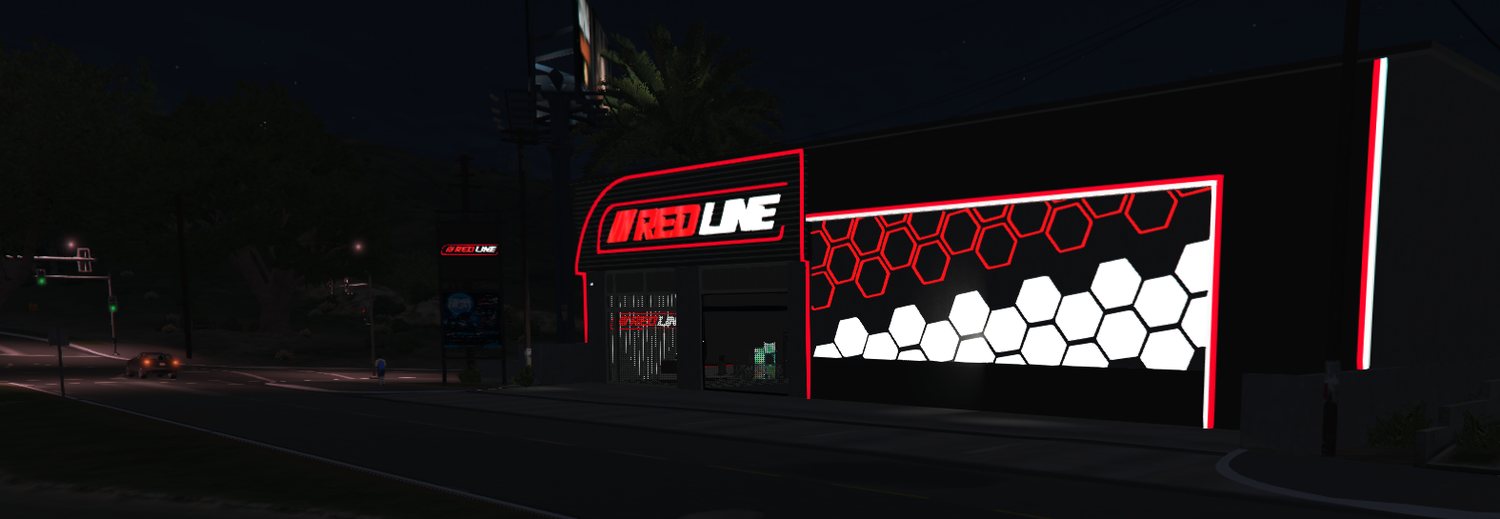 The Redline workshop lit with red neon