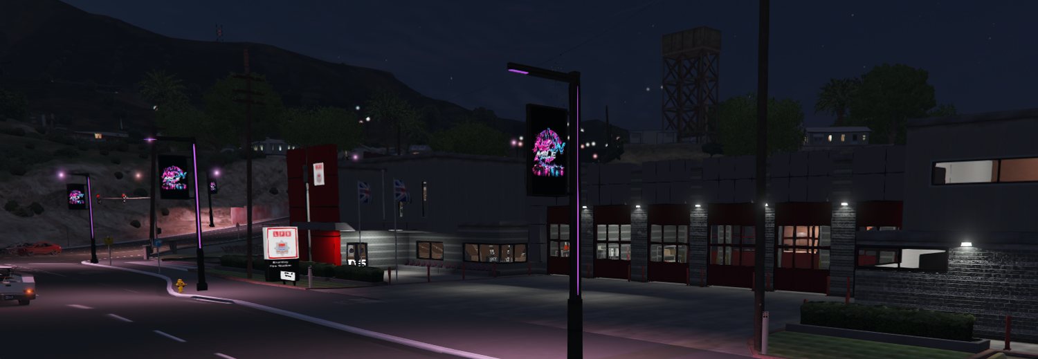 A street with Neon Mile RP banners on the lamp posts