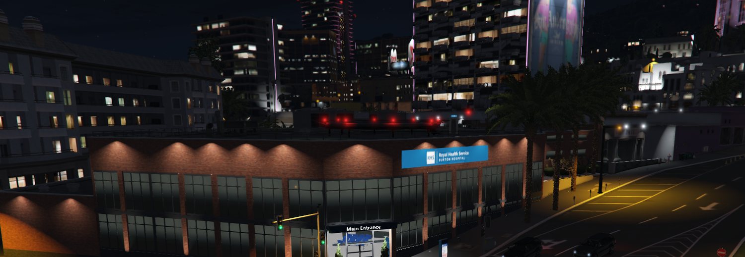 City streets at night with shops and offices